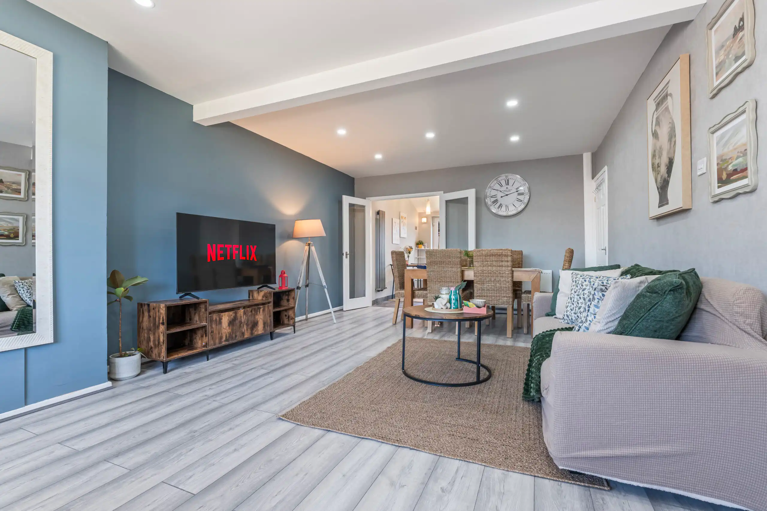 Modern living room with TV and dining area