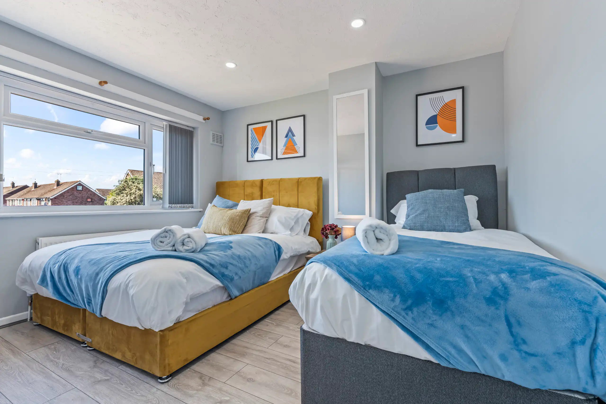 Bright modern bedroom with two single beds