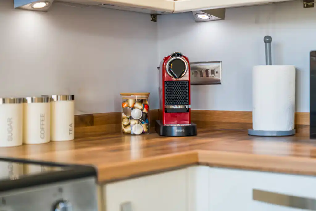 Red espresso machine on modern kitchen countertop