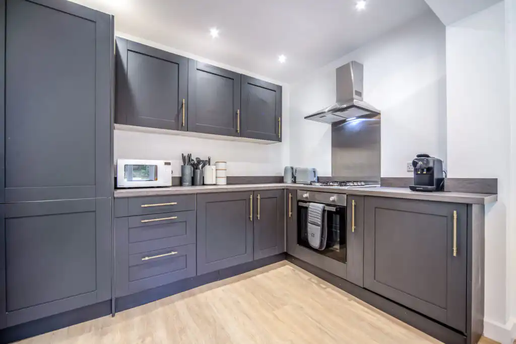 Modern gray kitchen with stainless steel appliances