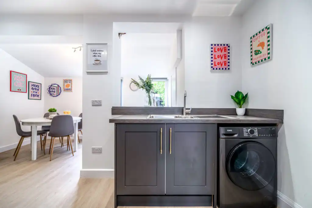 Modern kitchen and dining area with wall art